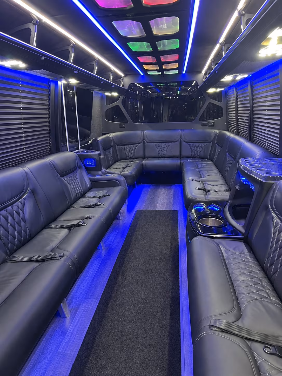 Friends laughing during a party bus celebration in Baltimore